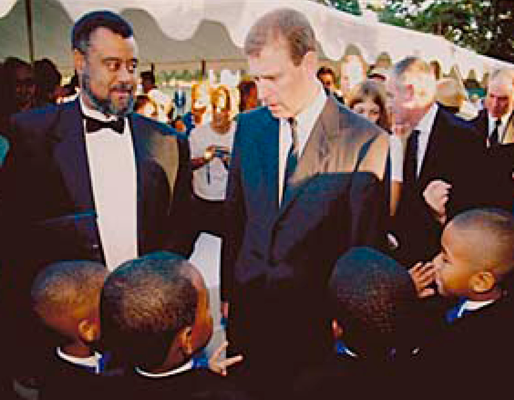Prince Andrew of York, England with members of the Poughkeepsie Boys Choir, 2002.