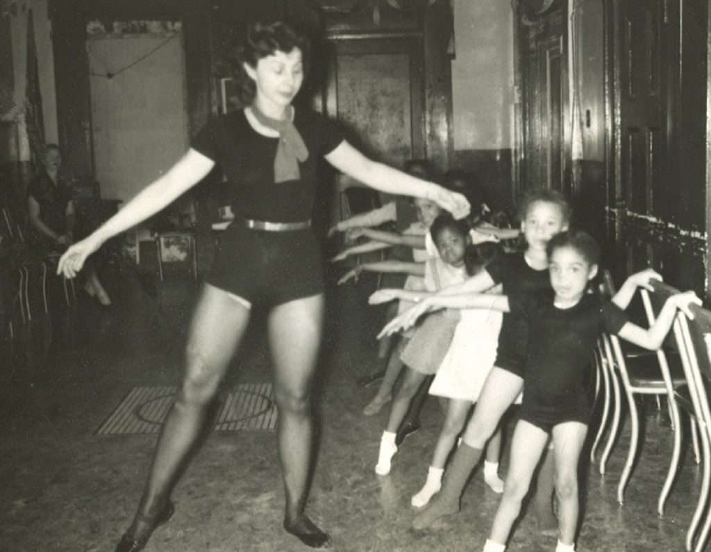 woman and small children doing ballet